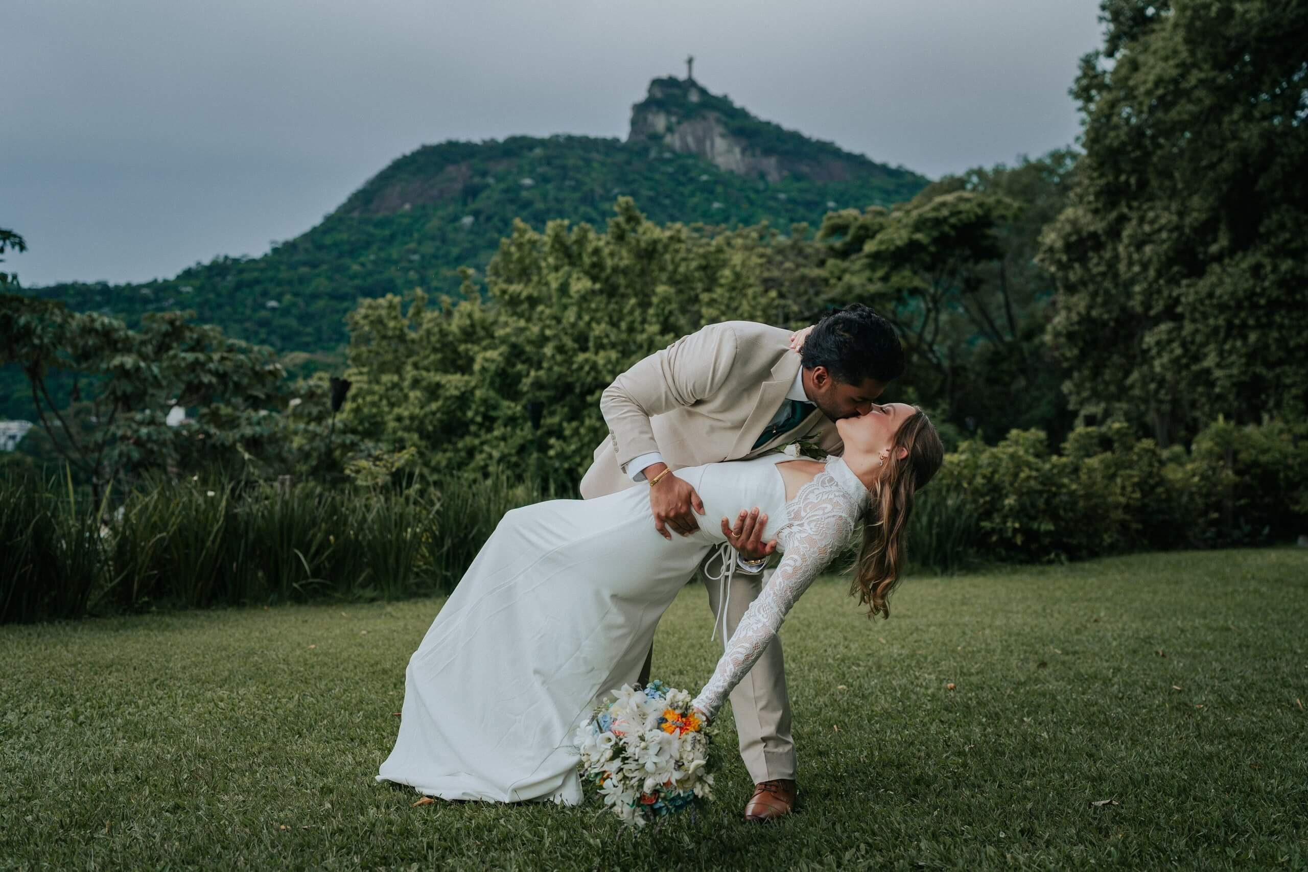 Destination wedding with elegant couple and panoramic view of Rio de Janeiro, romantic Brazil wedding photography.