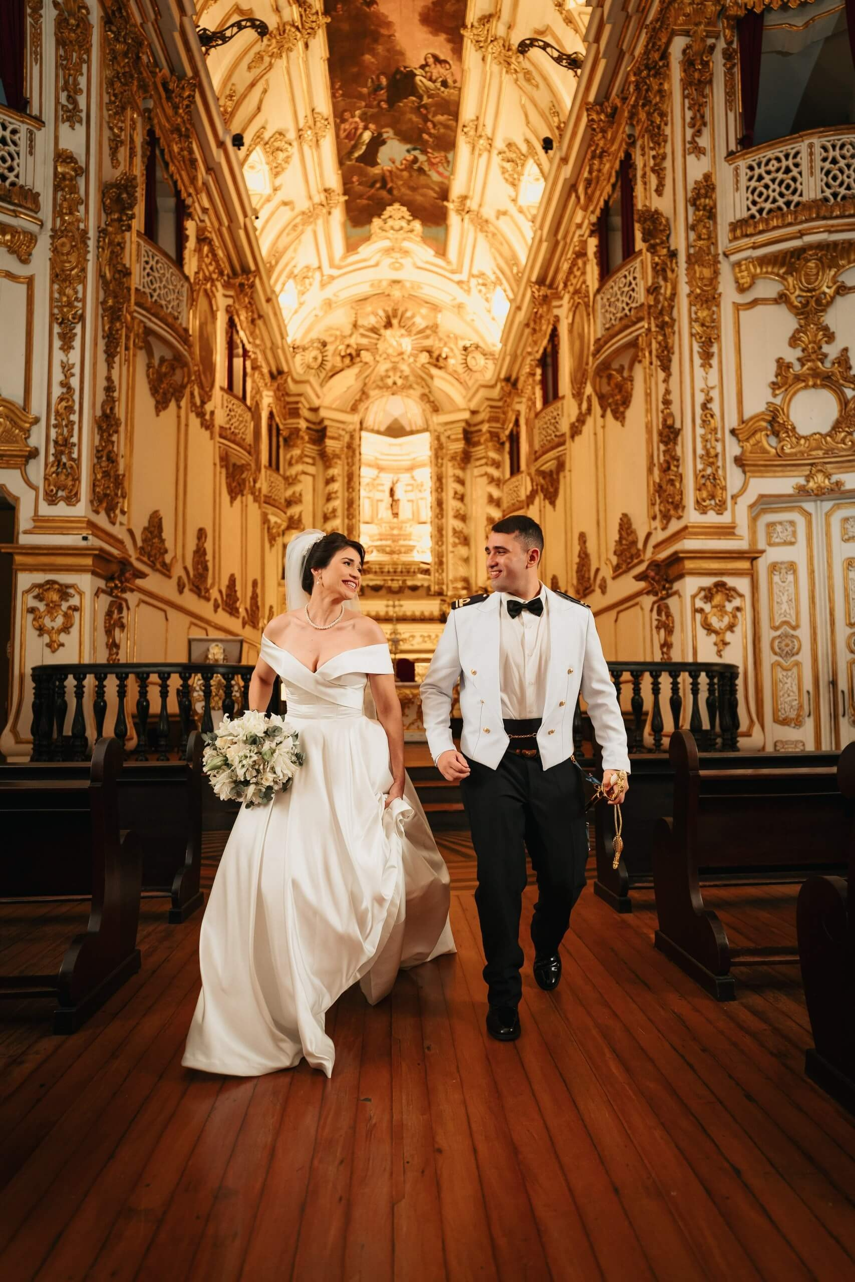 Spontaneous bride and groom in classic Catholic church wedding in Rio de Janeiro, elegant destination wedding in Brazil.