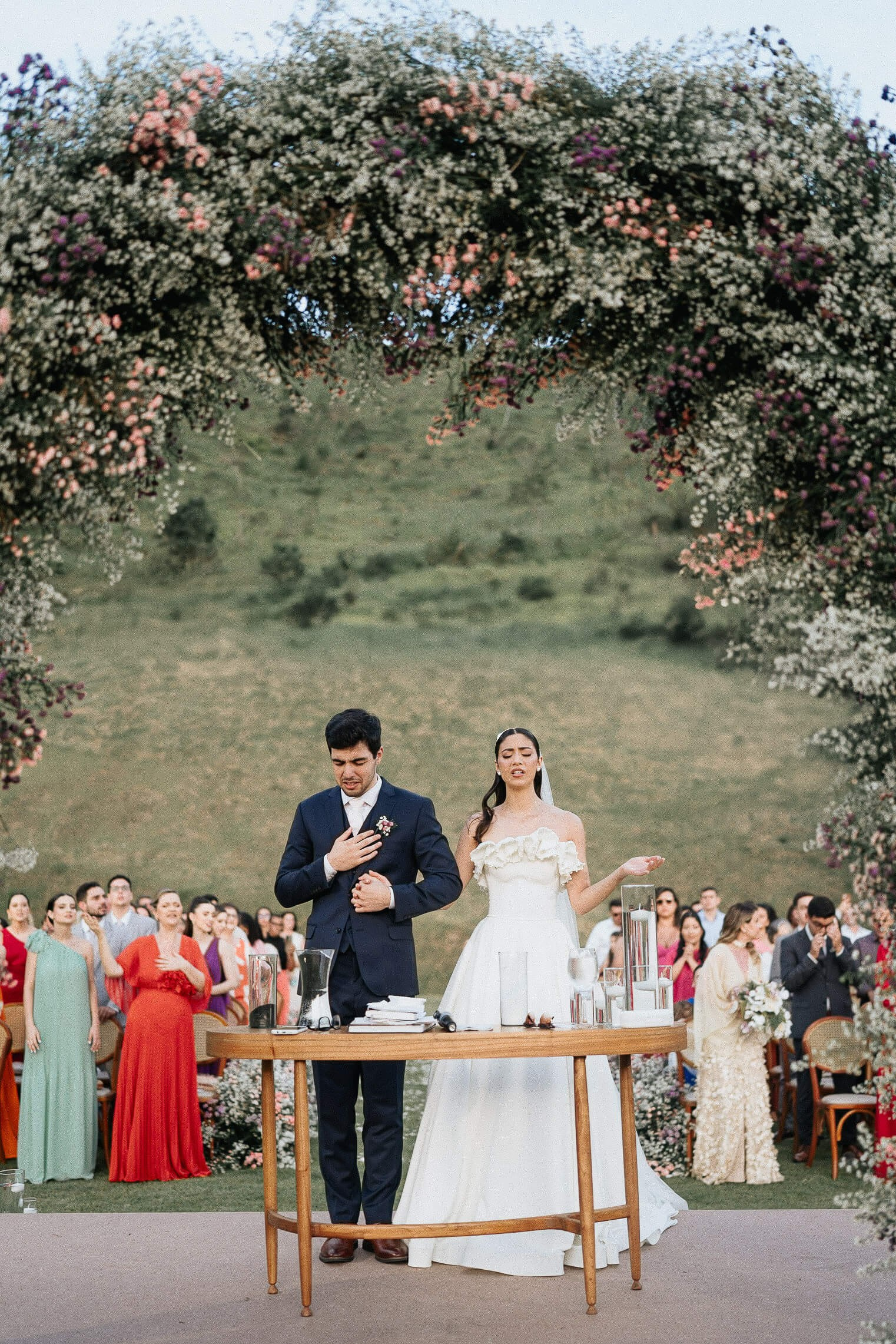 Couple in outdoor evangelical wedding ceremony in Rio de Janeiro, intimate destination wedding in Brazil.